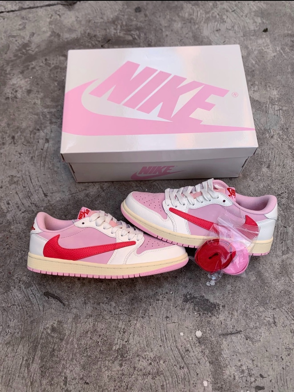 Travis Scott Nike Pink, Red and White Low-Top Sneakers